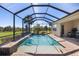 Relaxing pool and patio area with screened enclosure and water feature at 110 Asti Ct, North Venice, FL 34275