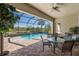 Relaxing pool and patio area with seating and screened enclosure at 110 Asti Ct, North Venice, FL 34275