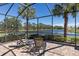 Screened patio with pool view and comfortable seating at 110 Asti Ct, North Venice, FL 34275