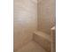 Spacious walk-in shower with built-in bench seat at 110 Asti Ct, North Venice, FL 34275