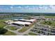 The aerial view captures the nearby school with sports fields, ample parking, and green spaces at 12029 Perennial Pl, Lakewood Ranch, FL 34211