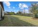 Grass lawn, fence, and partial home view at 12029 Perennial Pl, Bradenton, FL 34211