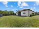 Landscaped backyard with home view at 12029 Perennial Pl, Lakewood Ranch, FL 34211