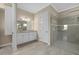 Elegant bathroom with granite vanity and large shower at 12029 Perennial Pl, Bradenton, FL 34211