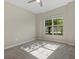 Spacious bedroom with large window and garden view at 12029 Perennial Pl, Bradenton, FL 34211