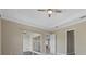 Bedroom with sliding glass doors opening to a patio at 12029 Perennial Pl, Lakewood Ranch, FL 34211