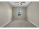 Well-lit bedroom with neutral walls and carpet flooring at 12029 Perennial Pl, Bradenton, FL 34211