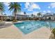 Community pool featuring marked lanes for swimming, tropical landscaping, and space for relaxation at 12029 Perennial Pl, Lakewood Ranch, FL 34211