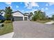 3-car garage, paver driveway, landscaping at 12029 Perennial Pl, Lakewood Ranch, FL 34211