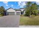 3-car garage, paver driveway, landscaping at 12029 Perennial Pl, Bradenton, FL 34211