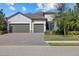 3-car garage, paver driveway, landscaping at 12029 Perennial Pl, Lakewood Ranch, FL 34211