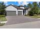 3-car garage, paver driveway, landscaping at 12029 Perennial Pl, Lakewood Ranch, FL 34211