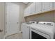 Laundry room with washer, dryer and cabinets at 12029 Perennial Pl, Bradenton, FL 34211