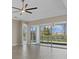 Open living space showcasing sliding glass doors and tile flooring at 12029 Perennial Pl, Lakewood Ranch, FL 34211