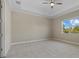 Large bedroom with plush carpeting and ceiling fan at 12029 Perennial Pl, Bradenton, FL 34211