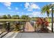 A tranquil pond with a dock and lush landscaping at 12029 Perennial Pl, Lakewood Ranch, FL 34211