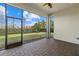 Screened patio with paver floor and backyard view at 12029 Perennial Pl, Bradenton, FL 34211