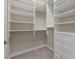 Spacious walk-in closet with ample shelving and drawers at 12029 Perennial Pl, Bradenton, FL 34211