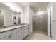 Elegant bathroom with granite countertops and a walk-in shower at 12251 Myrtle Bay Ct, Sarasota, FL 34238