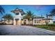 Elegant clubhouse entrance with palm trees at 12251 Myrtle Bay Ct, Sarasota, FL 34238