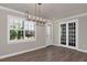 Spacious dining area with hardwood floors and a chandelier at 12251 Myrtle Bay Ct, Sarasota, FL 34238