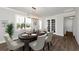 Elegant dining room features a chandelier and French doors at 12251 Myrtle Bay Ct, Sarasota, FL 34238