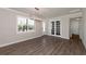 Bright dining room with hardwood floors and large window at 12251 Myrtle Bay Ct, Sarasota, FL 34238