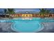 Resort-style pool with a clubhouse and lounge area at 12251 Myrtle Bay Ct, Sarasota, FL 34238