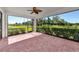 Screened lanai with brick pavers and lush landscaping at 12251 Myrtle Bay Ct, Sarasota, FL 34238