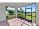 Screened lanai with pond and lush landscape views at 12251 Myrtle Bay Ct, Sarasota, FL 34238