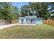 Picture of the back of the house with a gravel driveway, and nice yard at 1259 39Th St, Sarasota, FL 34234