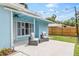 Cozy back patio area featuring modern furniture and string lights, perfect for outdoor relaxation at 1259 39Th St, Sarasota, FL 34234