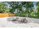 Backyard featuring a fire pit area with comfortable seating, perfect for entertaining guests at 1259 39Th St, Sarasota, FL 34234