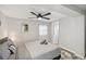 This bright bedroom features a ceiling fan, wood flooring, and a comfy bed at 1259 39Th St, Sarasota, FL 34234