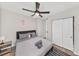 This comfortable bedroom features a ceiling fan and a closet at 1259 39Th St, Sarasota, FL 34234