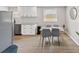 Modern dining area featuring a stylish table, contemporary gray chairs, and bright natural light at 1259 39Th St, Sarasota, FL 34234