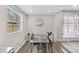 Cozy dining area with natural light, a modern round mirror, and a stylish four-chair table set at 1259 39Th St, Sarasota, FL 34234