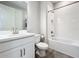 Clean bathroom with white cabinets, a bathtub, and modern fixtures at 15305 Isla Palma Ln, Nokomis, FL 34275