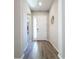 Bright foyer with wood-look tile flooring at 15305 Isla Palma Ln, Nokomis, FL 34275