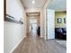 Long hallway with wood-look tile floors at 15305 Isla Palma Ln, Nokomis, FL 34275