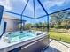 Hot tub in a screened-in patio area at 15305 Isla Palma Ln, Nokomis, FL 34275