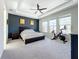 Spacious main bedroom with king bed, exercise bike, and plenty of natural light at 15305 Isla Palma Ln, Nokomis, FL 34275