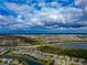 Wide aerial view of a residential area with a lake and expansive landscape at 16219 Tradewind Ter, Bradenton, FL 34211