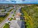 Aerial view of a residential neighborhood with houses and a lake at 16219 Tradewind Ter, Bradenton, FL 34211