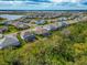 Aerial view of a residential neighborhood situated near a vast green landscape at 16219 Tradewind Ter, Bradenton, FL 34211