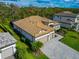 Luxury home with tile roof, paver driveway, and lush landscaping at 16219 Tradewind Ter, Bradenton, FL 34211