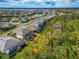 Aerial perspective of houses nestled in a landscape with a large wooded area at 16219 Tradewind Ter, Bradenton, FL 34211