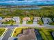 An aerial view of a single-Gathering home with a three-car garage at 16219 Tradewind Ter, Bradenton, FL 34211