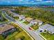 Aerial view of a luxury residential neighborhood with modern homes and lush landscaping at 16219 Tradewind Ter, Bradenton, FL 34211