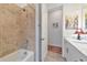 Well-appointed bathroom with shower/tub combo and neutral tile at 16219 Tradewind Ter, Bradenton, FL 34211